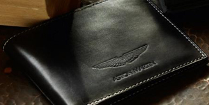 Aston Martin Billfold Wallet In black leather with grey stitching and embossed Aston Martin logo: ?120.