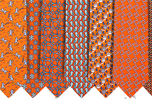 Hermès Printed Orange Hand-Folded 100% Silk Neckties: US$180 each.