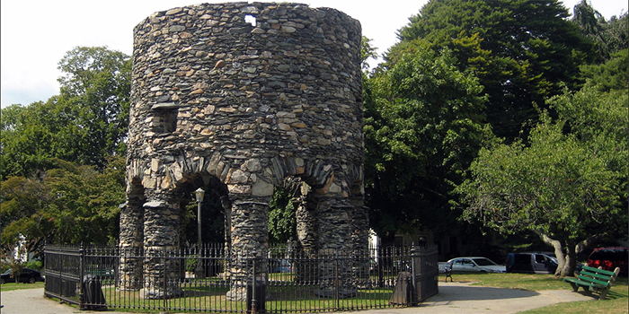 The Newport Tower (also known as: Round Tower, Touro Tower, Newport Stone Tower and Old Stone Mill) is a round stone tower located in Touro Park, Mill Street in Newport, RI 02840, U.S.A.