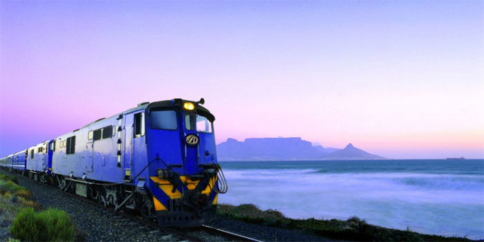 The Blue Train travels an approximately 1,600-kilometer (990 mi) journey in South Africa between Pretoria and Cape Town. It is one of the most luxurious train journeys in the world. It boasts butler service, two lounge cars (smoking and non-smoking), an observation car, and carriages with gold-tinted picture windows, in soundproofed, fully carpeted compartments, each featuring its own en-suite (many of which are equipped with a full-sized bathtub). The service is promoted as a 'magnificent moving five-star hotel' by its operators, who note that kings and presidents have travelled on it.