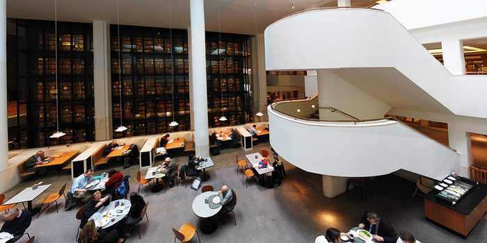 Interior of the British Library, with the smoked glass wall of the King's Library in the background.