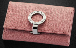 Bvlgari Women's Small flamant rose grain calf leather keychain with brass palladium plated hardware. Six internal keychains and one open inside compartment.