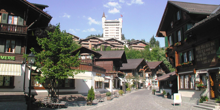 The Promenade in Gstaad village in the summer with the Gstaad Palace hotel in the backgorund, CH-3780 Gstaad, Switzerland.