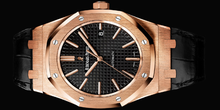 Audemars Piguet Royal Oak Selfwinding watch with date display and centre seconds. 18-carat pink gold case, silvered dial, black strap.