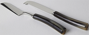 Brunello Cucinelli 2-piece steel & buffalo horn cheese cutlery set: US$645.